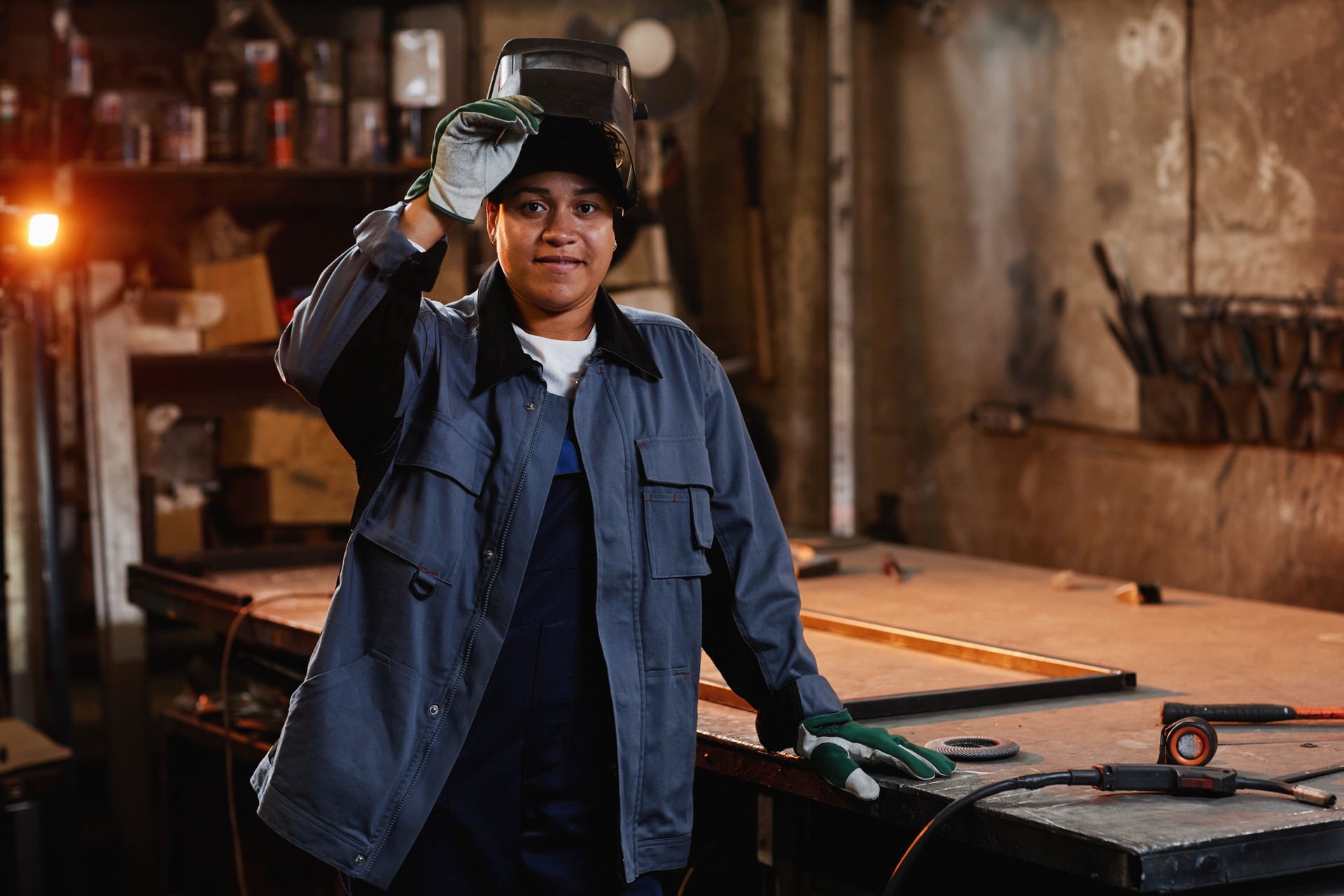 Smiling Female Welder In Workshop